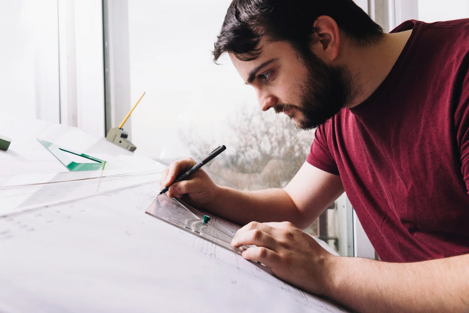 Design consultant marking up a revised drawing to respond to a construction RFI